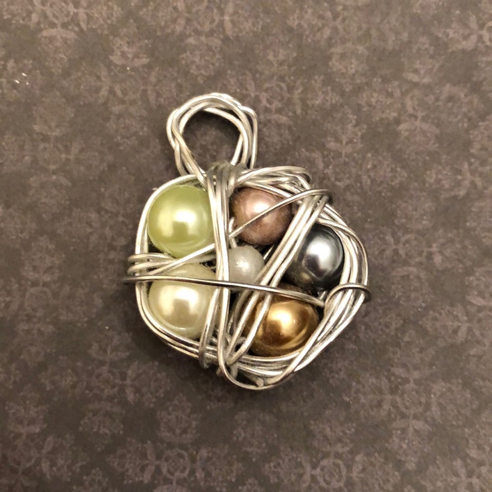 Adorable “Bird nest” pendant.